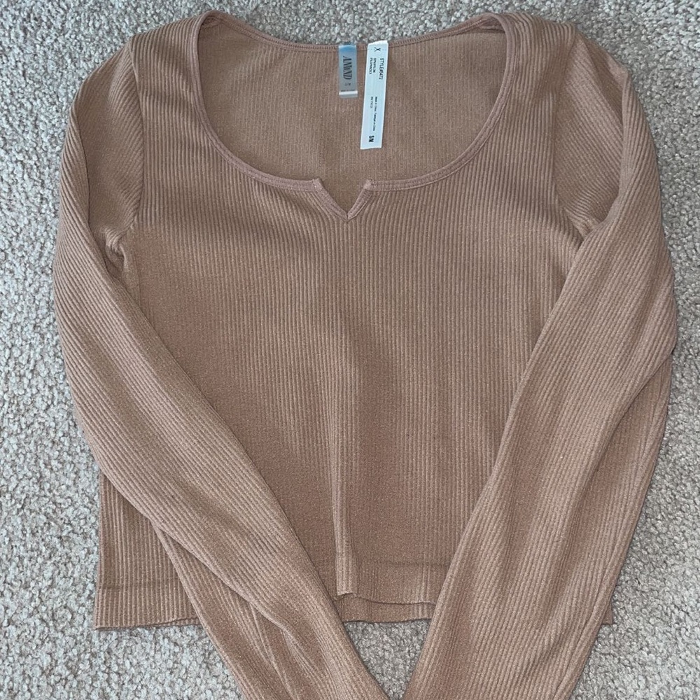 Spandex like material. Tan long sleeve.